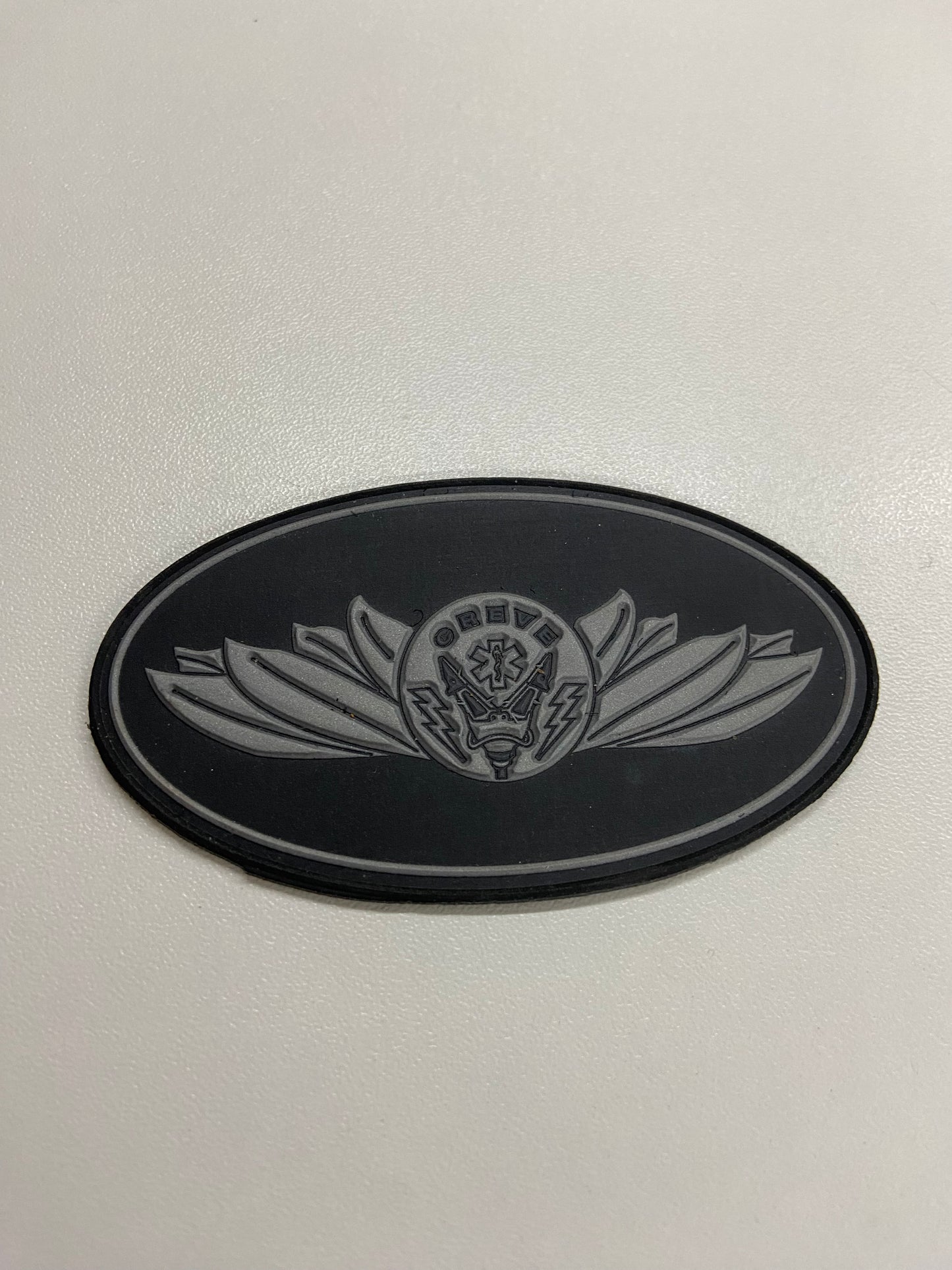 Distintivo emborrachado elipse CREVE